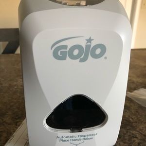 Hand sanitizer dispenser
